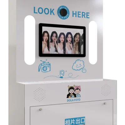 DOLA_FOTO_Korean_Style_Photo_Booth_Left_Front_Three_Quarter_View_Showcasing_User_Interaction_Zone_And_QR_Code_Payment_Scanner_For_B2B_Events